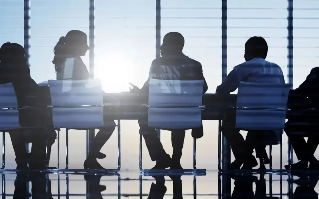 Business professionals in a boardroom meeting